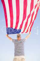Senior man holding american flag