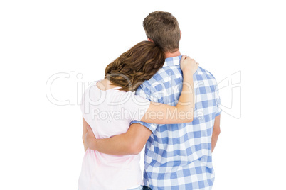 Rear view of young couple embracing