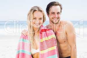 Portrait of happy couple on the beach