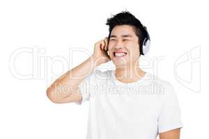 Young man listening to music on headphones