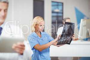 Female doctor examining X-ray