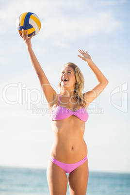 Woman playing beach volley