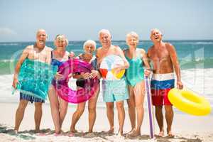 Seniors standing in a row at the beach