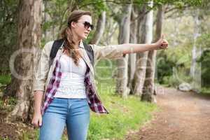 Portrait of woman hitch hiking