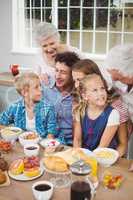 Multi-generation family having breakfast
