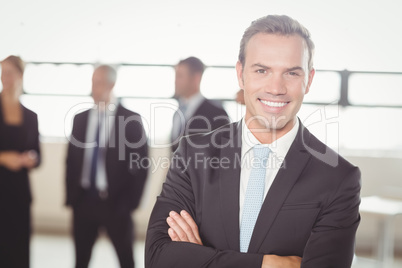 Portrait of young businessman smiling at camera