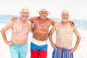 Senior men standing at the beach