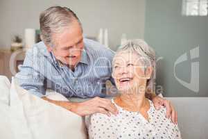Romantic senior man with his wife at home