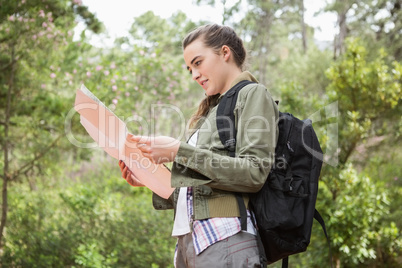 Woman with map and backpack