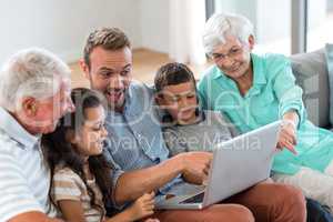 Happy family sitting on sofa