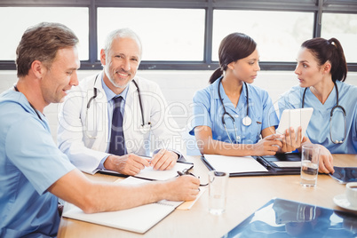 Portrait of male doctor smiling in conference room