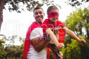 Father and daughter pretending to be a superhero