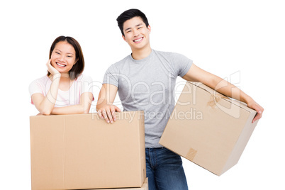 Young couple with cardboard boxes