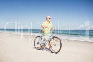Smiling senior man with bike