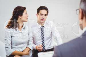 Clients discussing with businessman