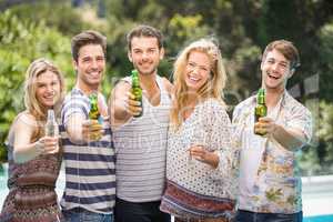 Group of friends showing their beer bottles