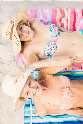 Portrait of women lying on the beach