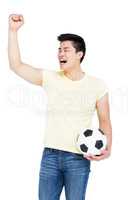 Man holding a football and cheering