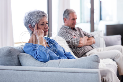 Upset senior couple ignoring each other