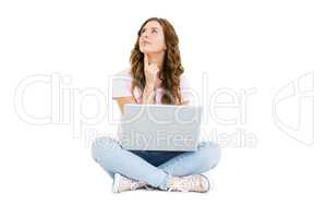 Thoughtful young woman using laptop