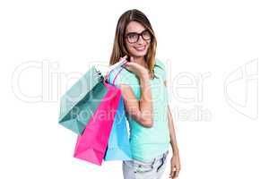 Portrait of smiling woman holding shopping bags