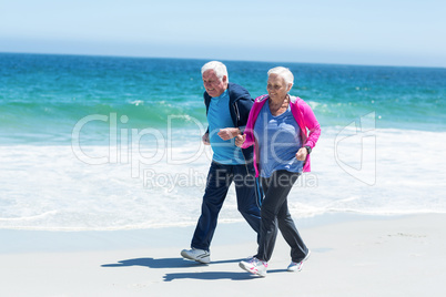 Cute mature couple running together