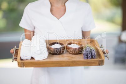Masseur holding tray with spa therapy products