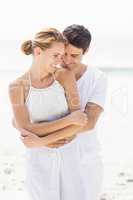 Young couple embracing on the beach