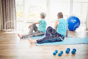 Rear view of couple doing yoga