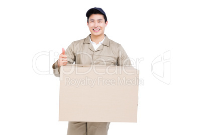 Delivery man with cardboard box giving a thumbs up