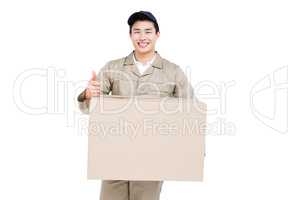 Delivery man with cardboard box giving a thumbs up