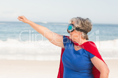 Senior woman wearing superwoman custome