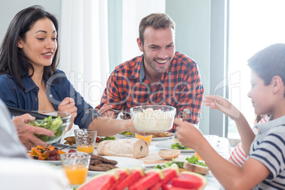 Happy family having breakfast