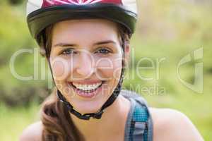 Smiling woman wearing a helmet