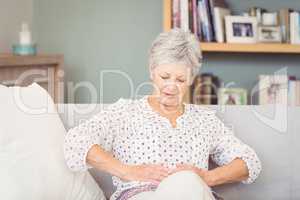 Senior woman suffering from stomach pain