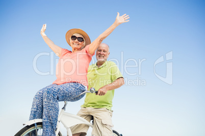 Senior couple going for a bike ride