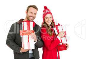 Young couple holding gifts