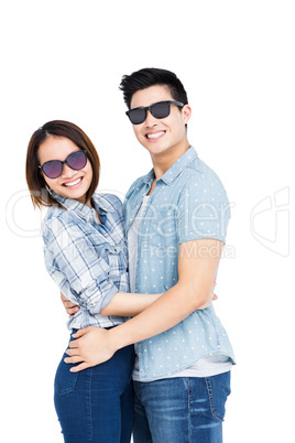 Happy young couple embracing each other