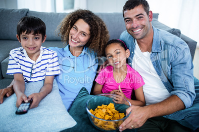 Portrait of family watching match together
