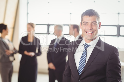 Portrait of excited young businessman