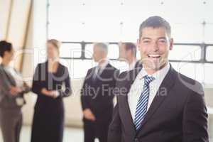 Portrait of excited young businessman
