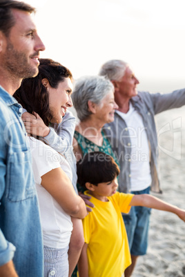 Happy family posing at the beach