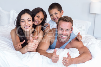 Happy family in their bedroom