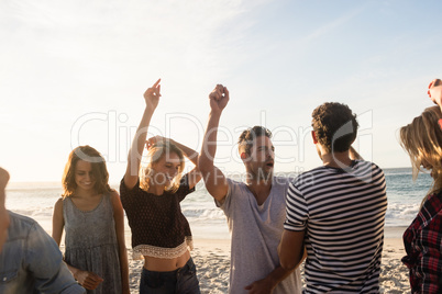 Happy friends dancing together