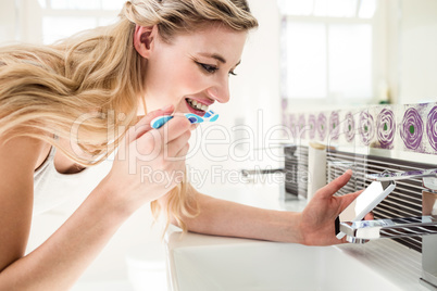 Young woman brushing teeth