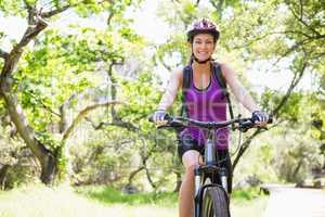 Smiling woman cycling