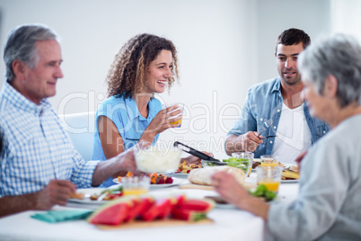 Happy family having breakfast together