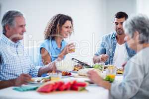 Happy family having breakfast together