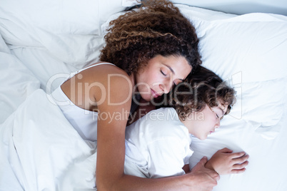 Mother and son sleeping together