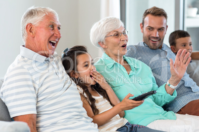 Happy family sitting on sofa